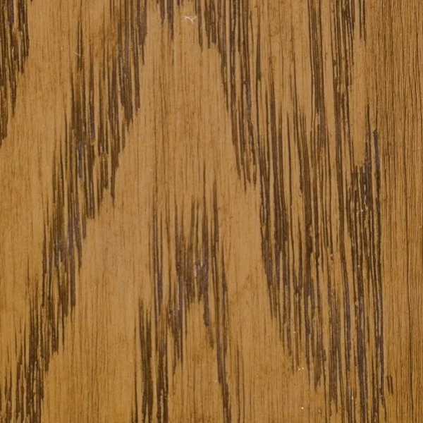 Close-up of a wooden surface with dark streaks and grain patterns.