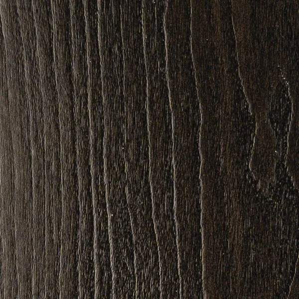 Close-up of a dark wood surface with visible grain and texture.