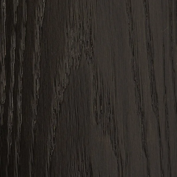 Close-up of a dark-colored wooden surface with visible wood grain texture.