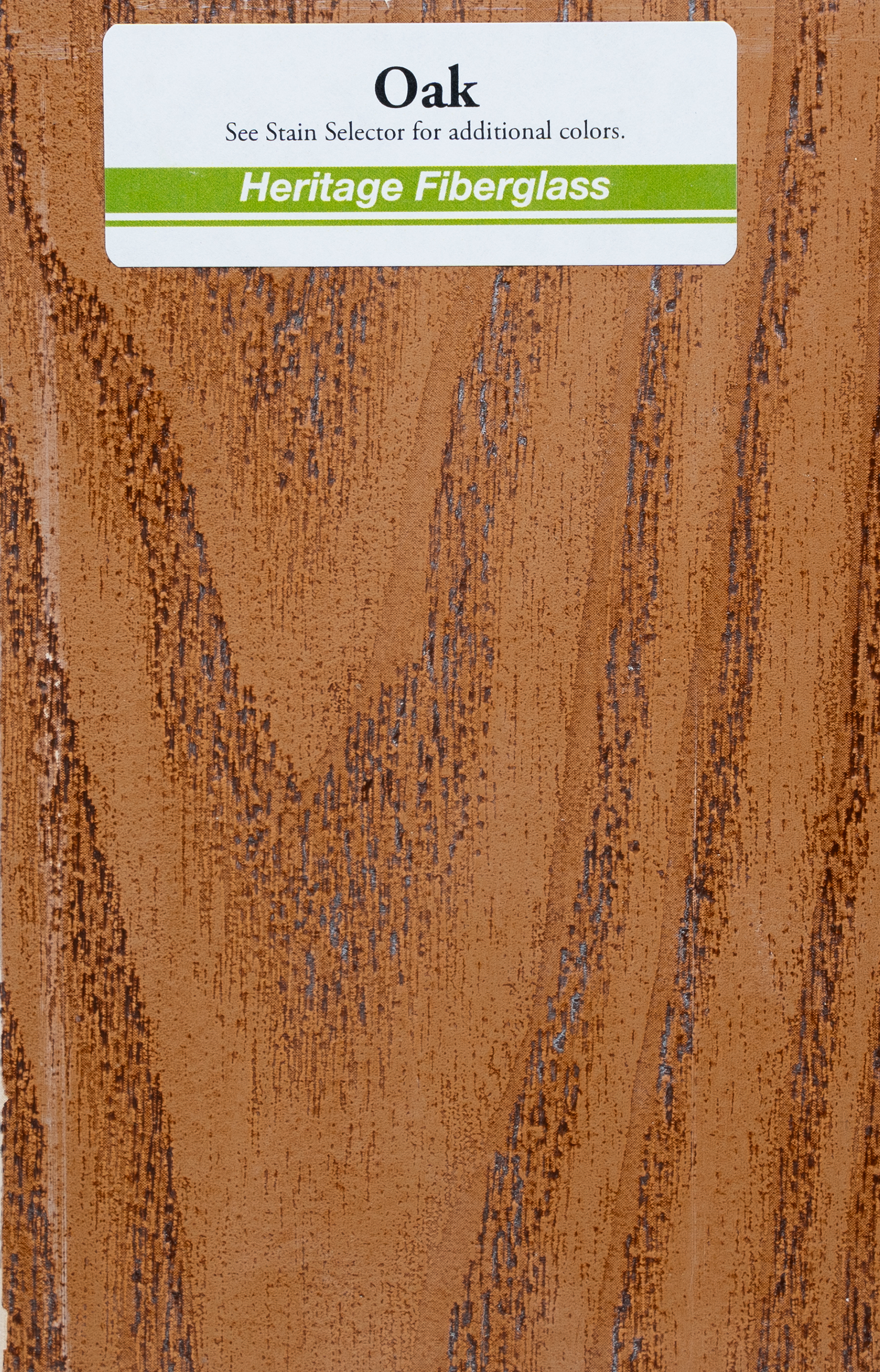 Close-up of a wood grain pattern sample labeled Oak from Heritage Fiberglass, with a tan and brown textured appearance.