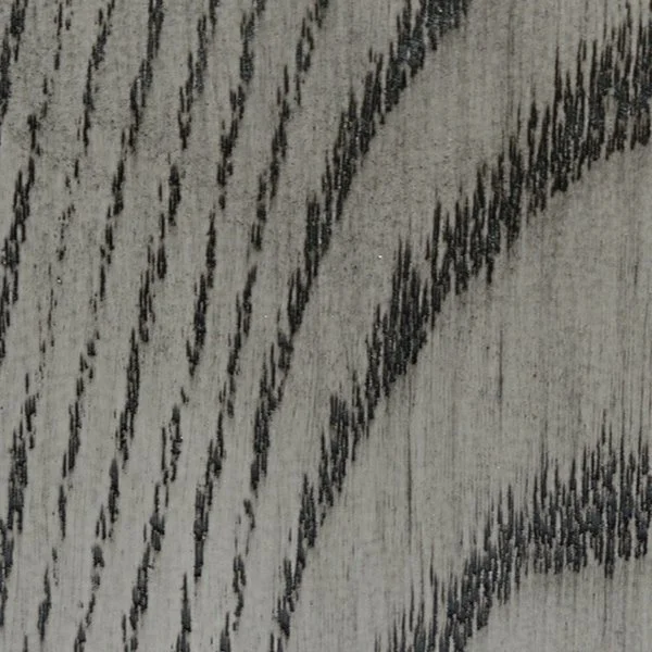 Close-up of a textured surface with black linear patterns on a gray background