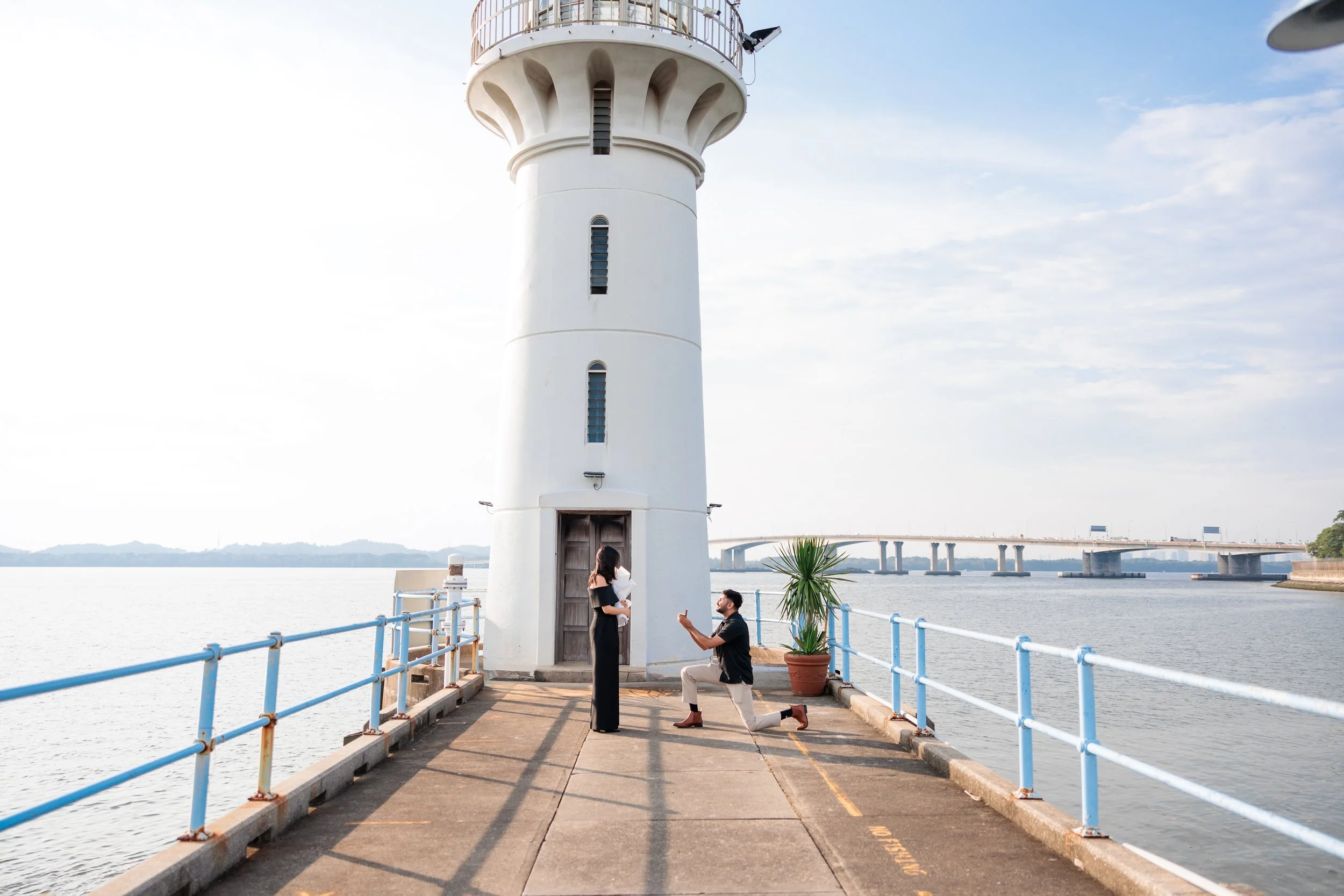 Singapore Proposal Photography. Singapore Engagement Photography. Quiet Proposal Singapore. Hidden Proposal Singapore. Candid Proposal Singapore. Raffles Marina Lighthouse Proposal SingaporeSunset Proposal. Golden Hour Proposal.