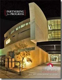 Cover of a booklet titled 'Partnering for Progress' featuring a modern building exterior at night, part of the University of New Mexico, with text indicating the 2006 annual report of giving.