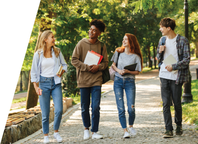 four college students walking to class