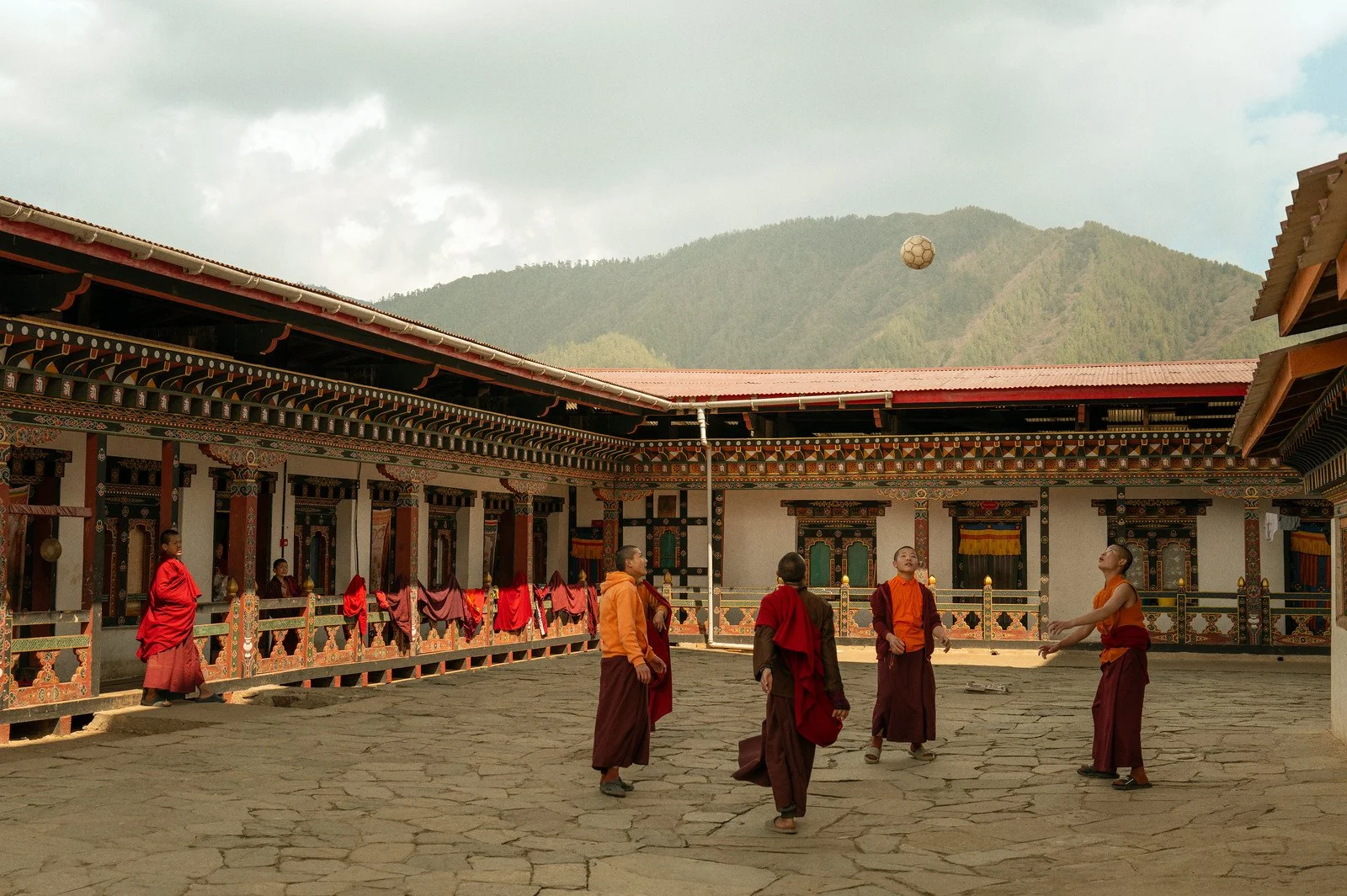 bhutan-monks-playing-courtyard.jpg