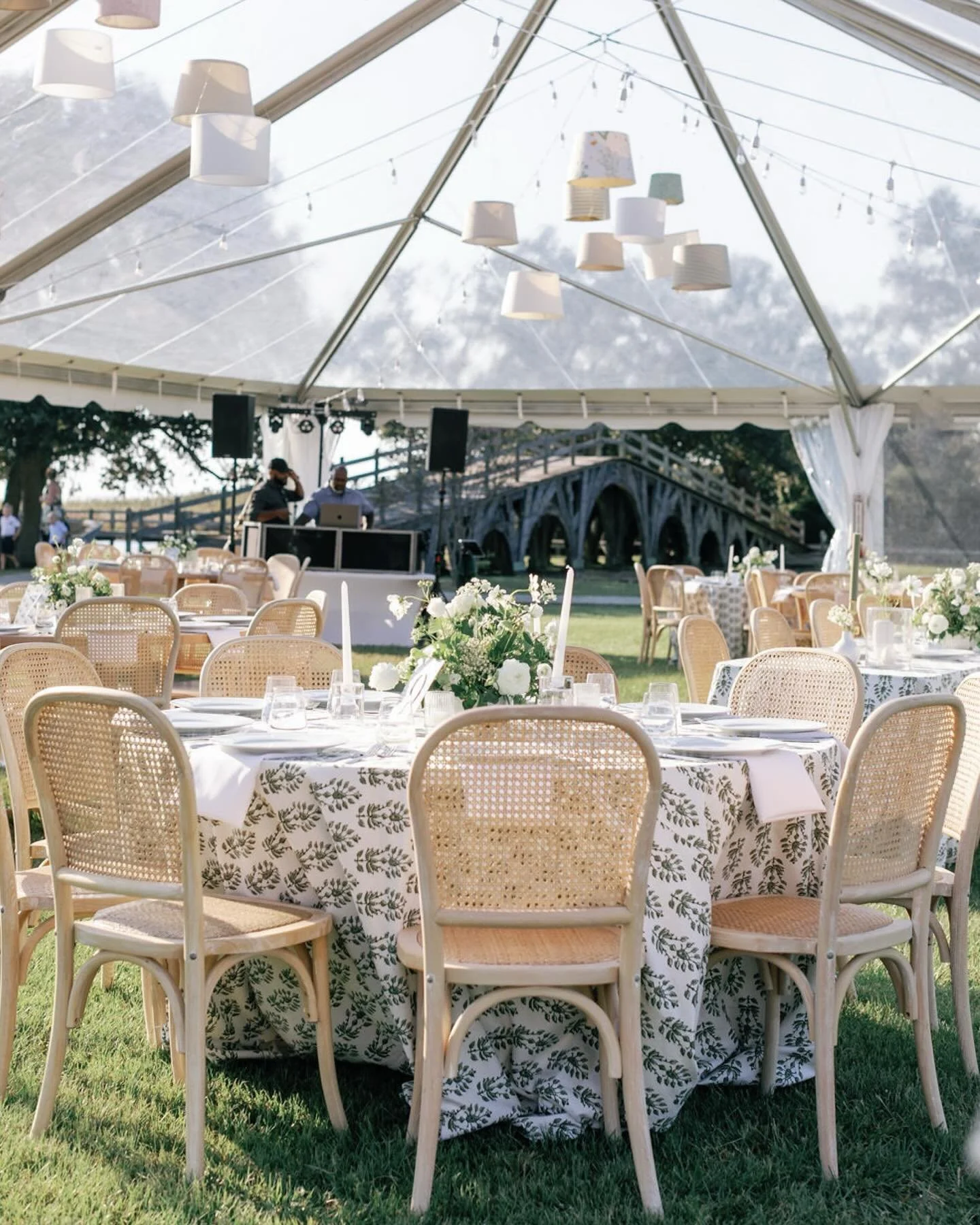 Under the sweeping branches of a centuries-old live oak at the Whalehead Club, a wedding day unfolded like a quiet poem for Madeline &amp; Matheus. 
Dappled sunlight filtered through the leaves, a light breeze carried the salt air, and the gentle rhy