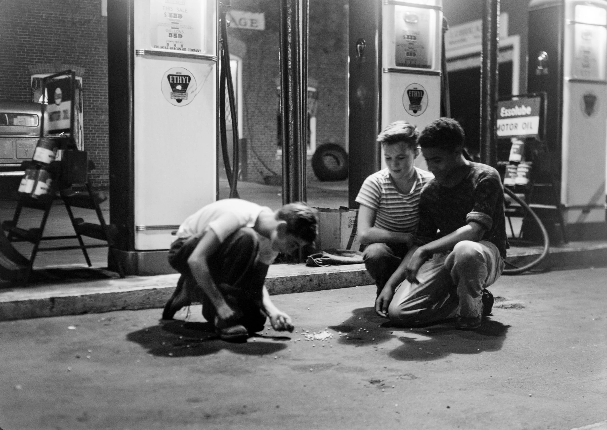 Boys playing at gas station
