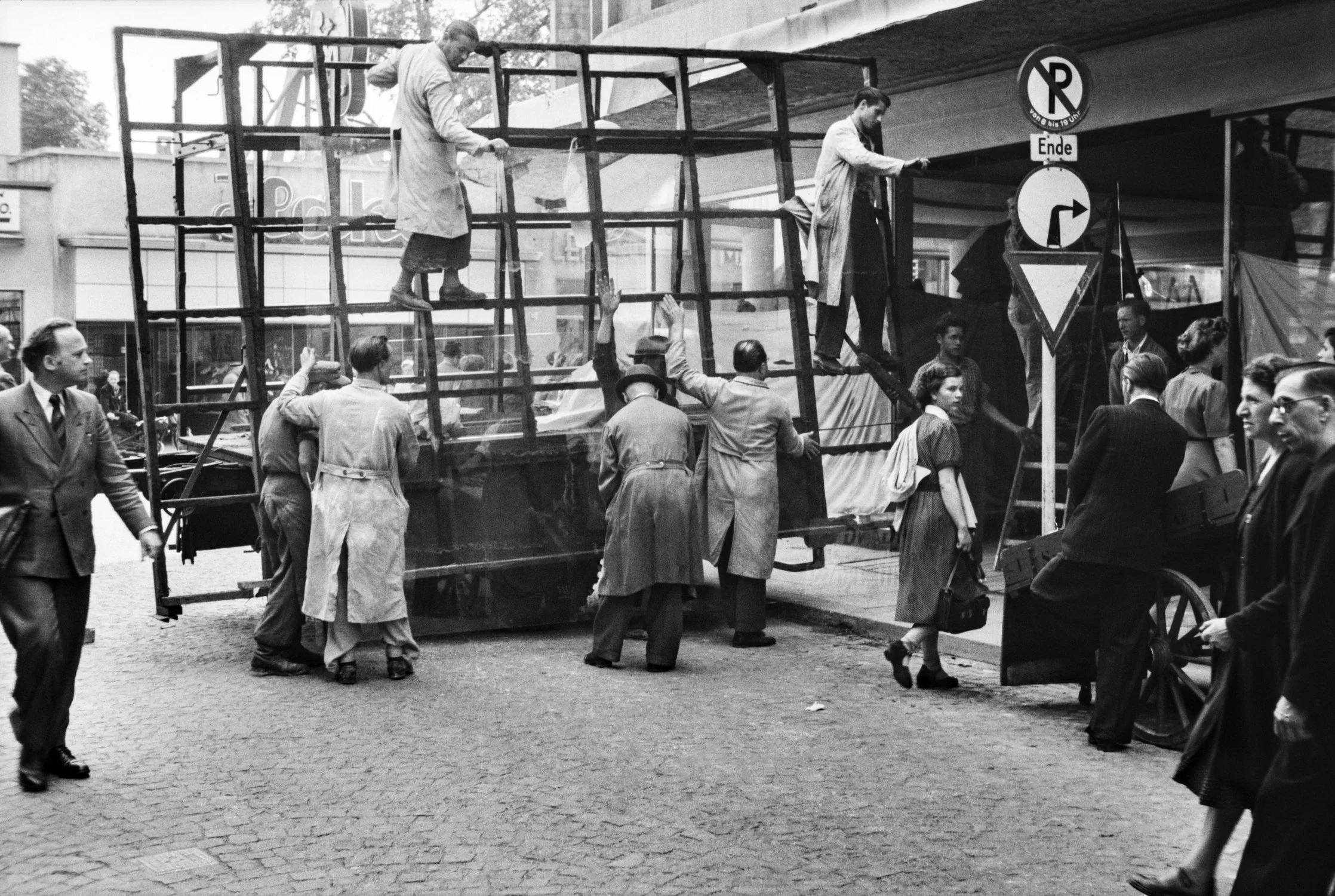 Workmen repair broken glass, Germany