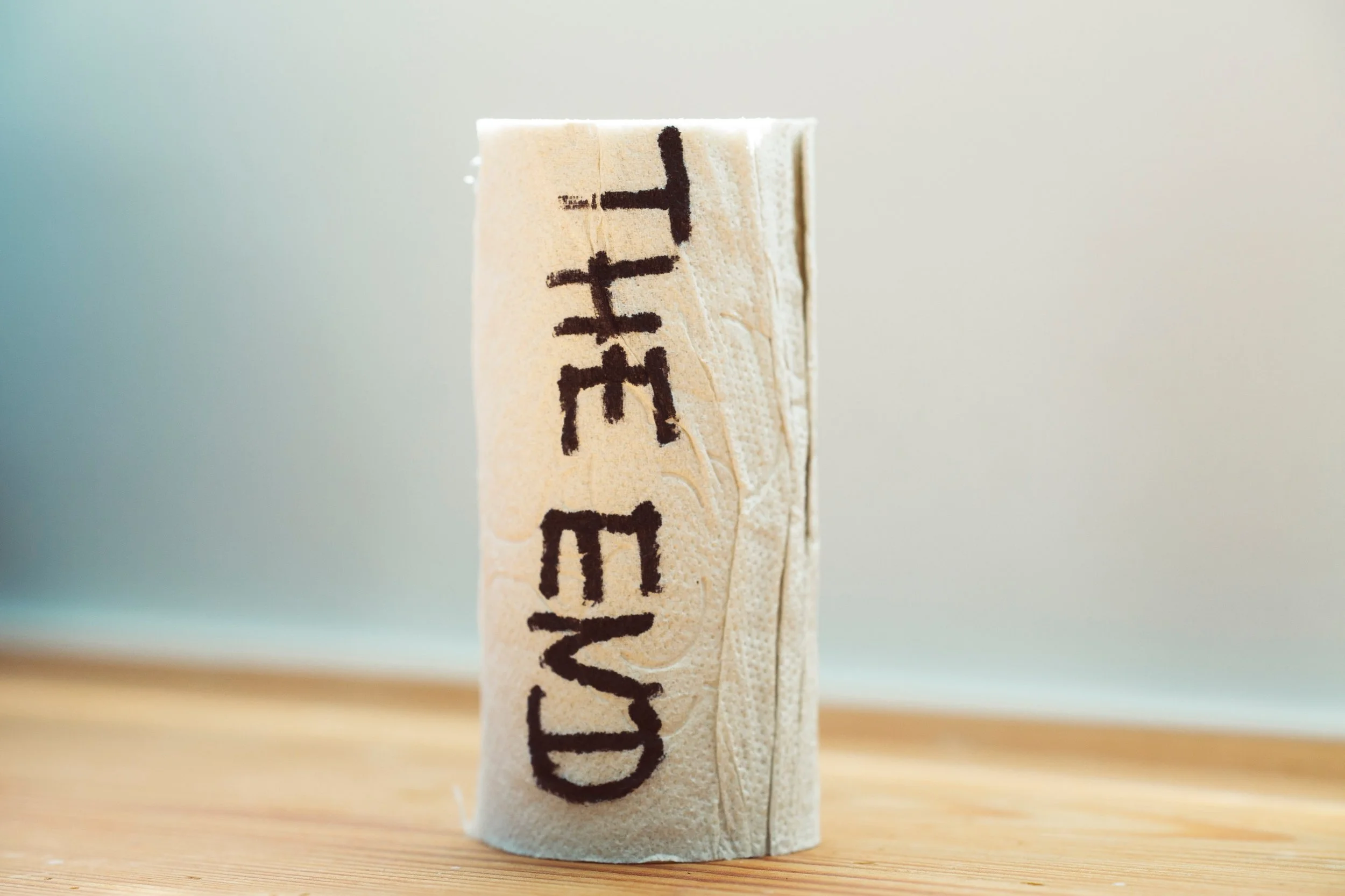 a roll of paper with the words "the end" printed on it signifying the decision to leave a relationship