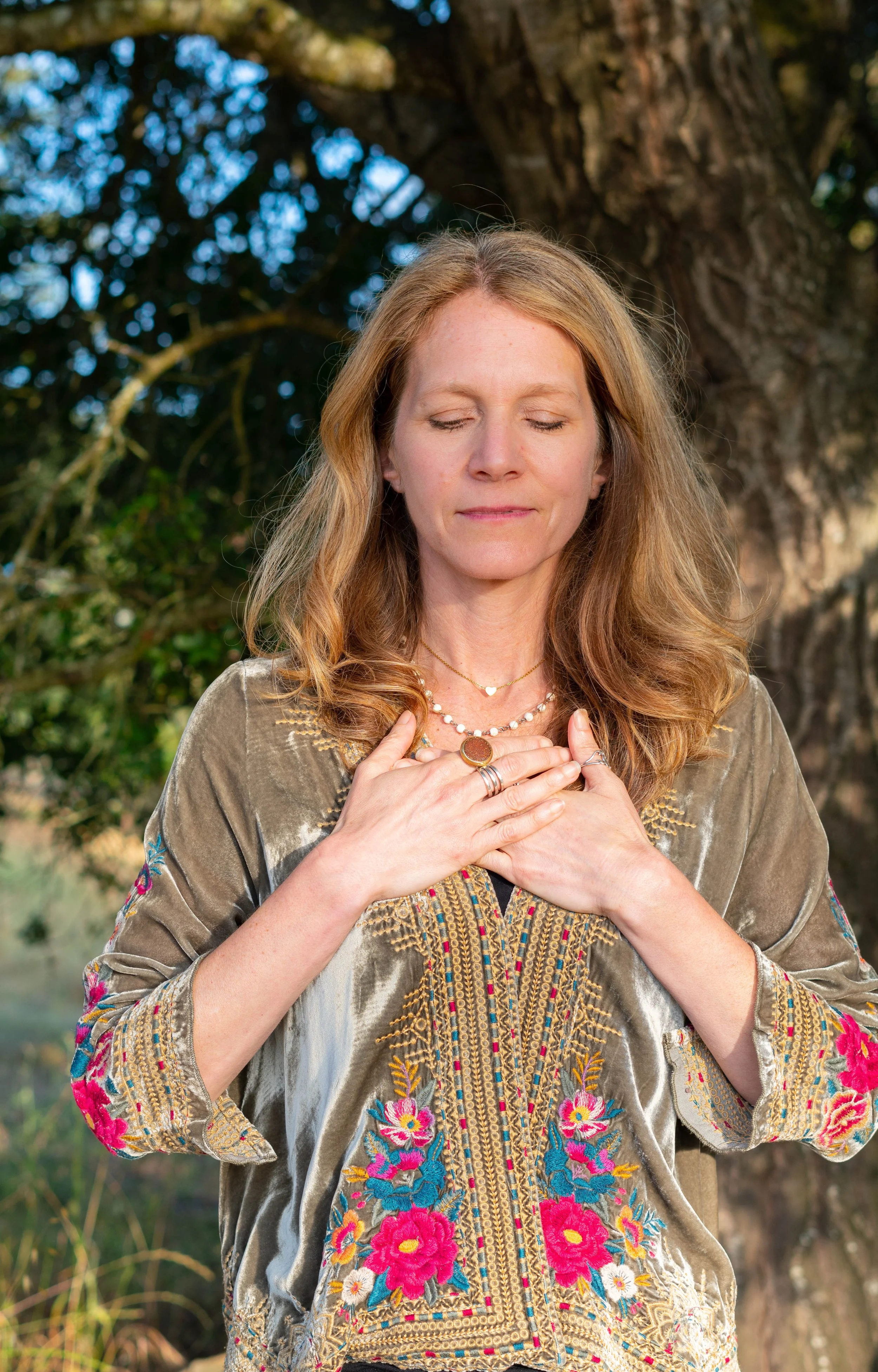 Ceremonial Facilitator & Therapist Jodie Stein with Hands on her heart
