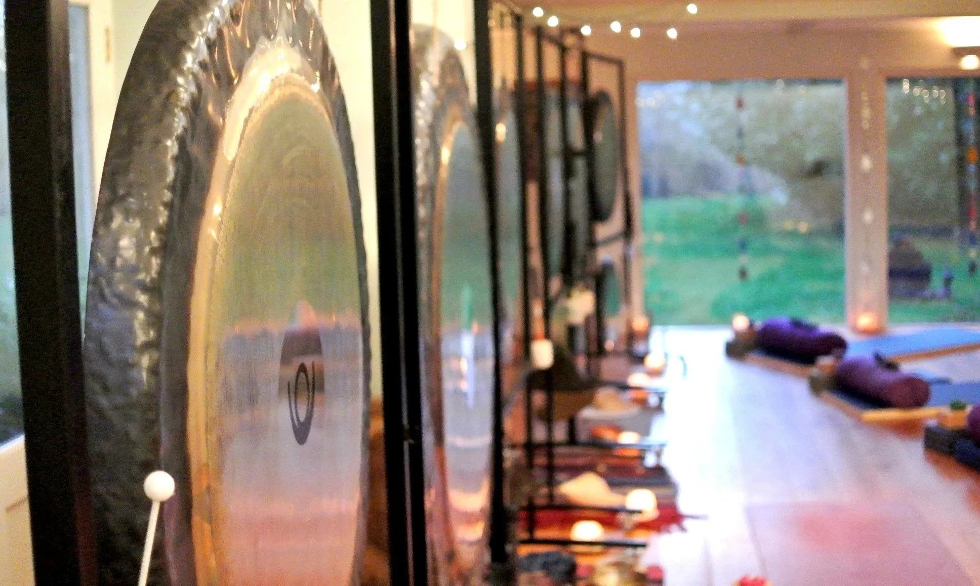 Gongs and sound healing instruments arranged for a sound bath session