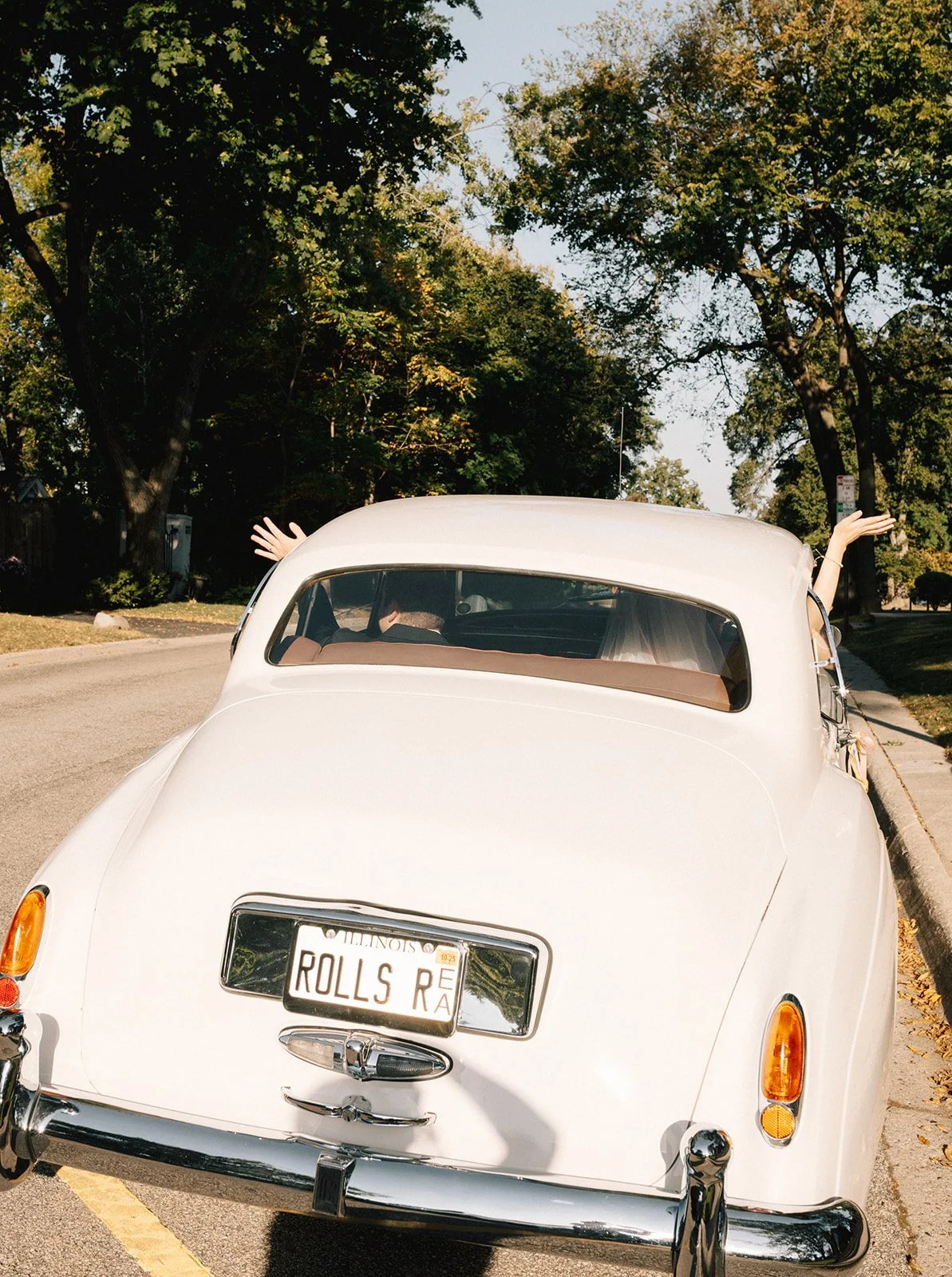 Bride and Groom Leaving in Rolls Royce Car - Photo - Abby Hart Photography 