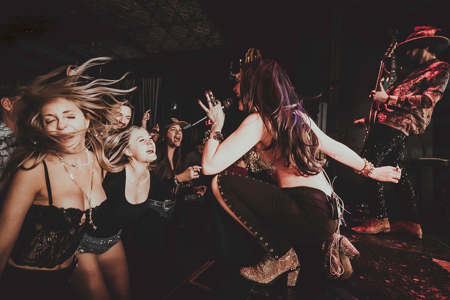 Lea Cappelli surrounded by fans dancing during a high-energy Vegas show