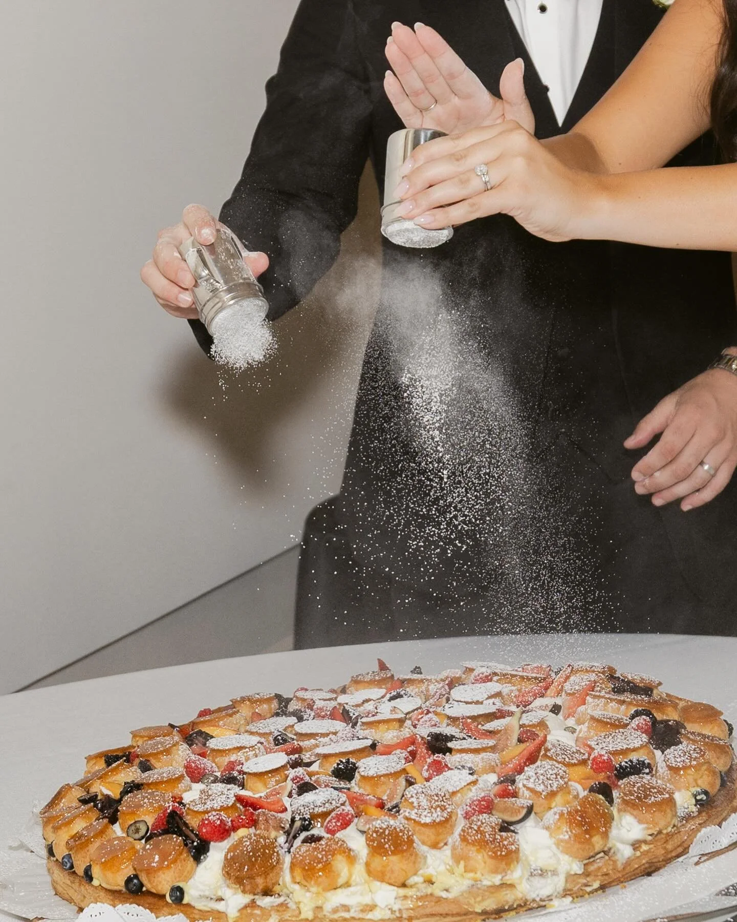 A + B had their eyes set on a traditional Italian wedding cake for their wedding, and dusted it with a fresh layer of powdered sugar just before their cake cutting - it was so fun! 🍰

Photo: @katluiphotography 
Cake: @emporiorulli 

#sanfranciscowed