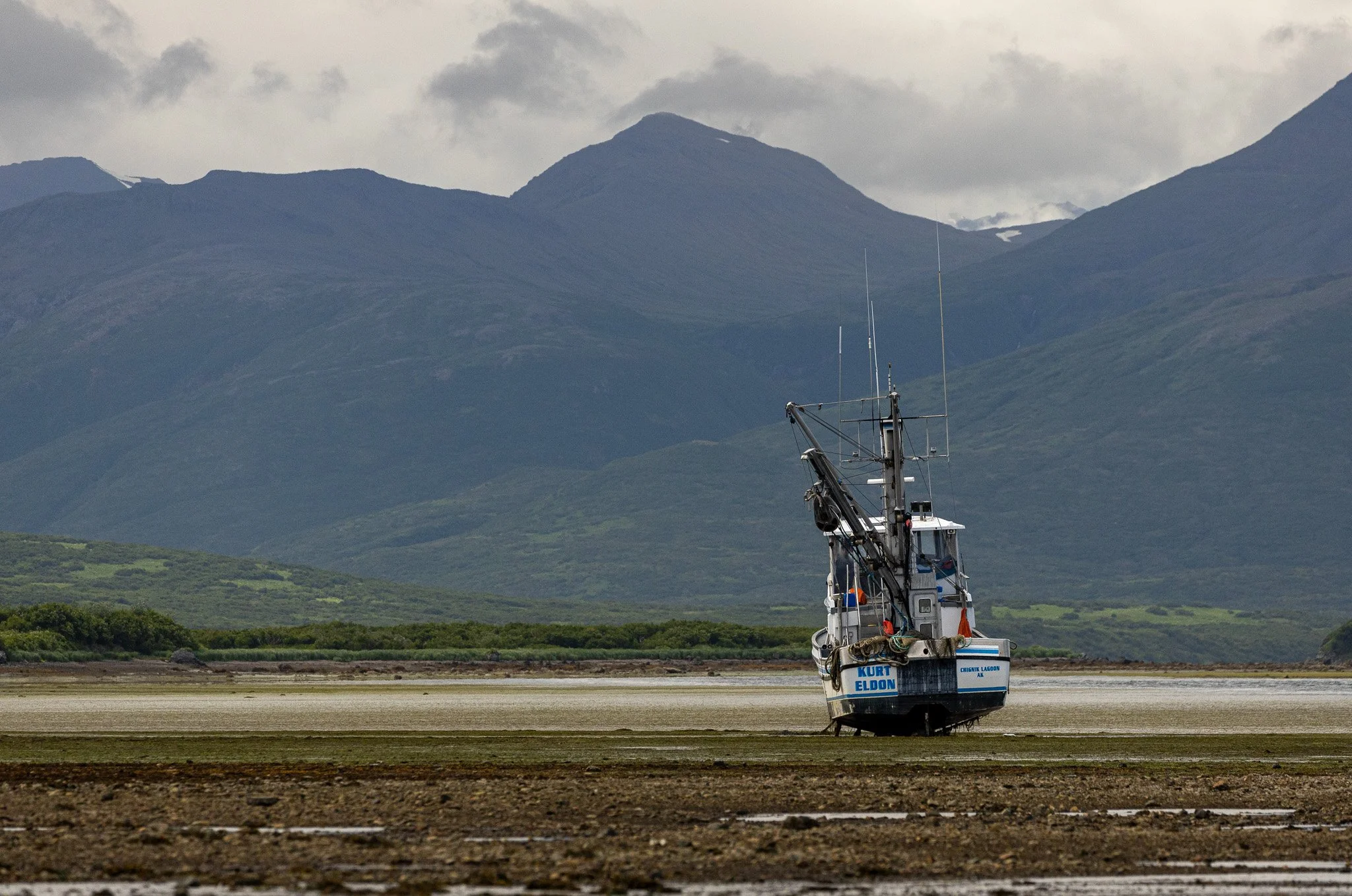 Boat on ground at low tide.
