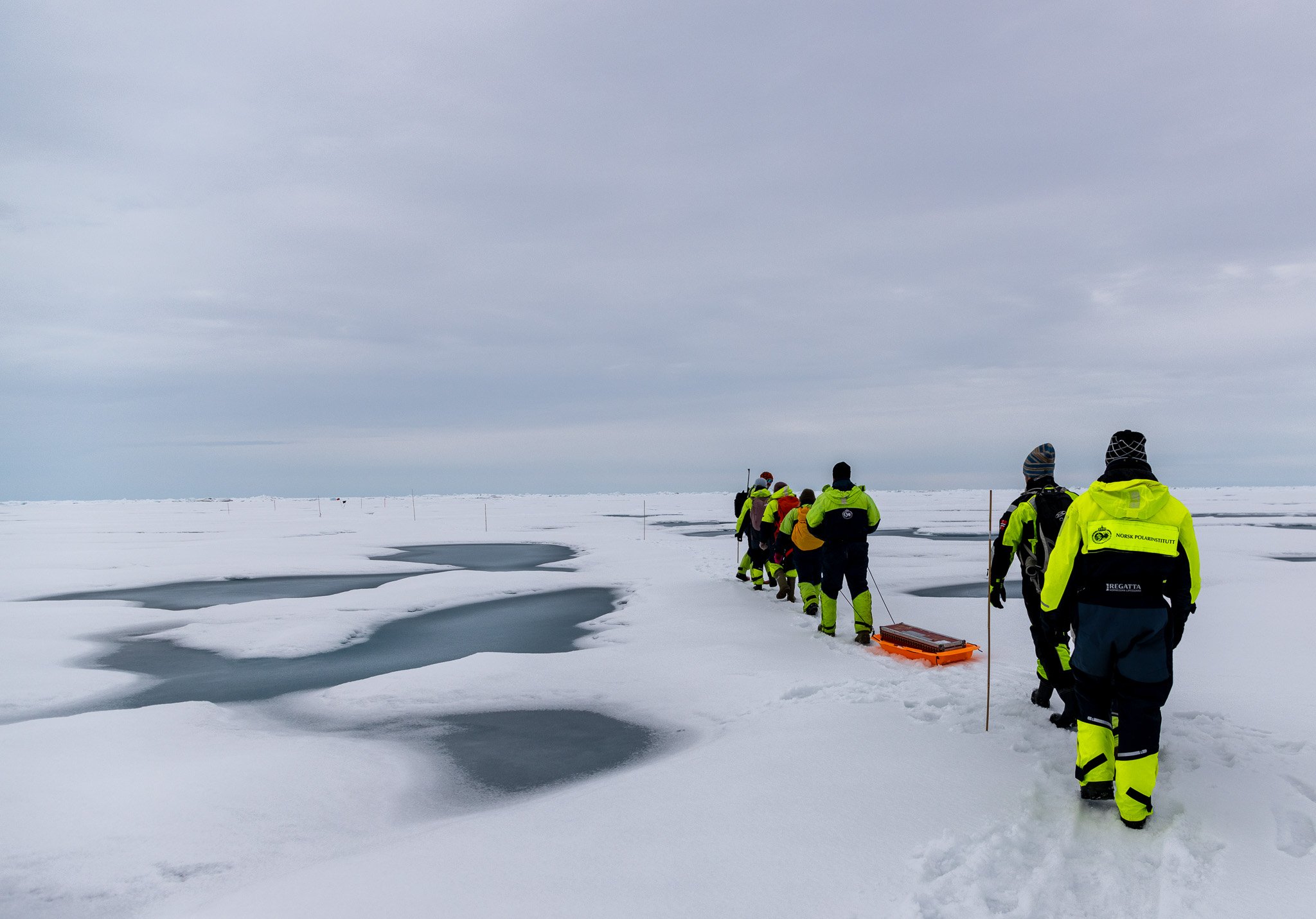Walking on the sea ice to our testing locations.