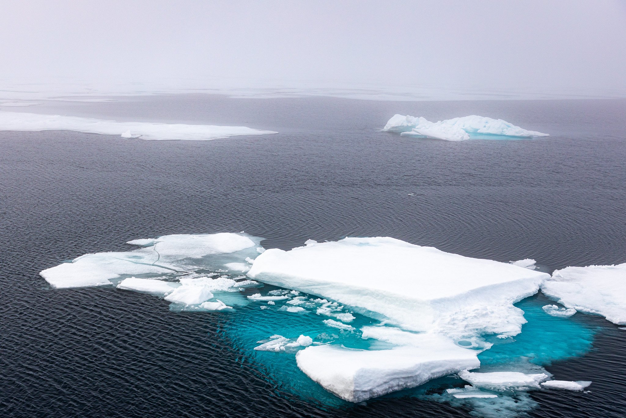 Some fog over the water and ice.