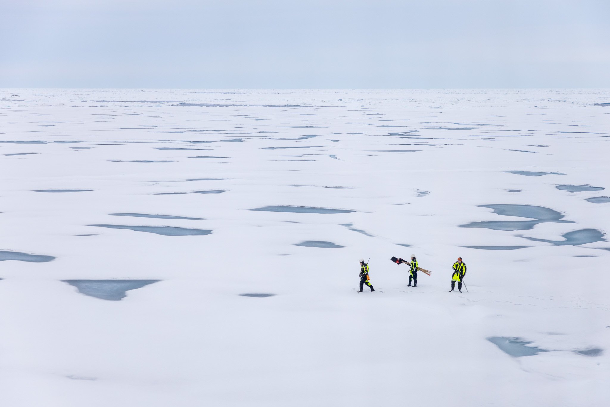 Testing the ice to make sure it was safe to take samples in the area.