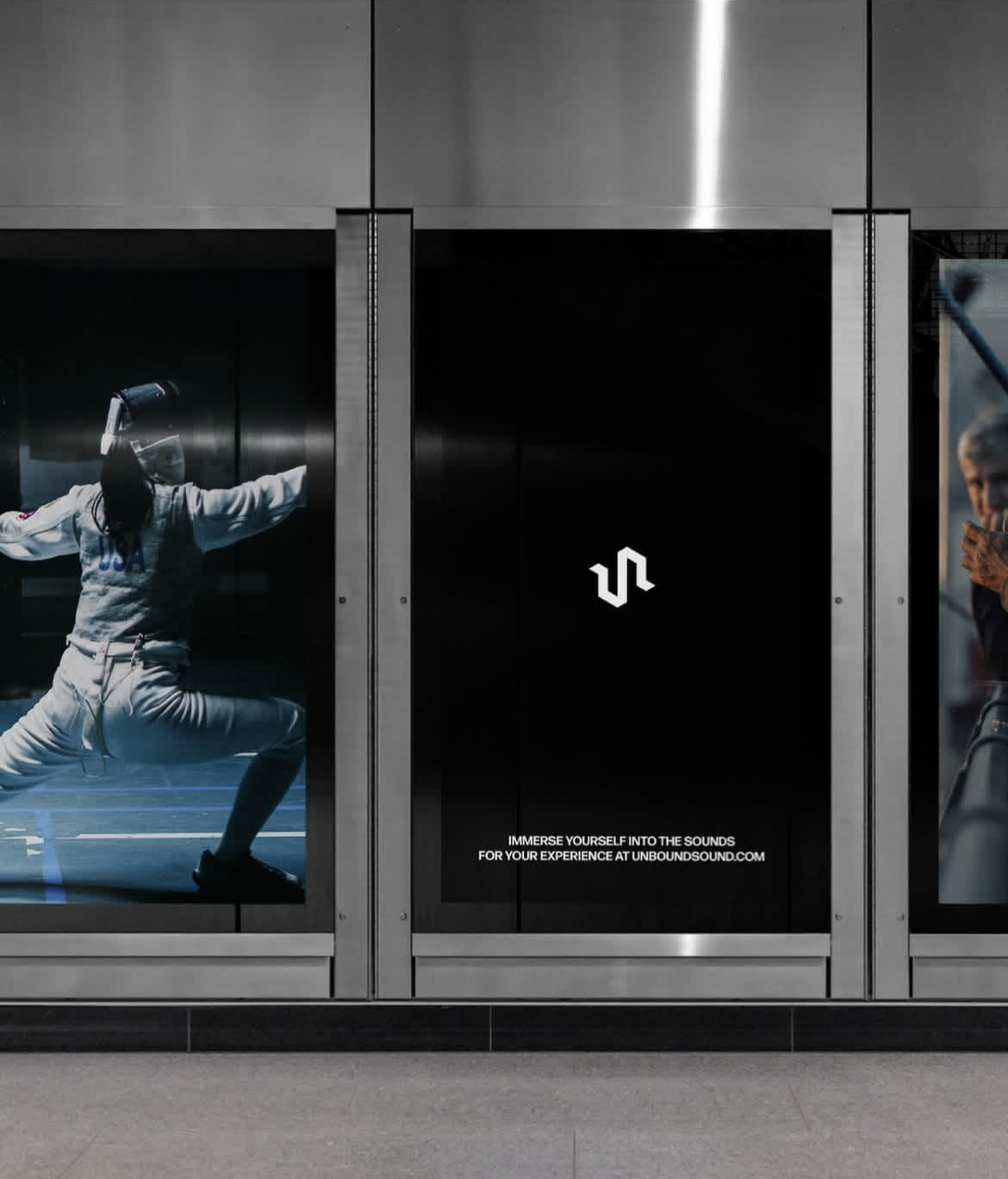 Photograph of an elevator door with an advertisement for Unbound Sound featuring a fencer in a stance with outstretched arms and a woman using her phone, both behind glass.