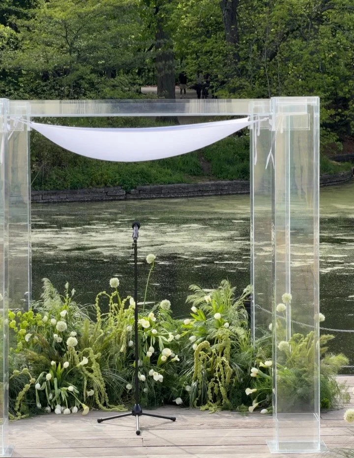 A promise under the chuppah, with florals inspired by swans 🦢