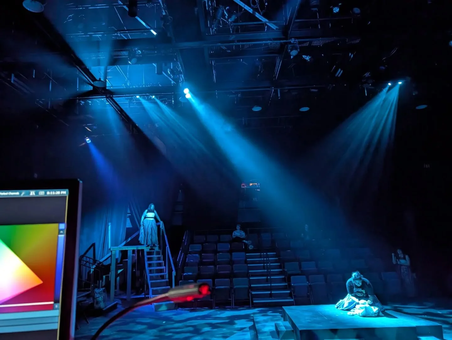 LIZZIE: THE MUSICAL (2026)

Shot from the lighting console during tech. 8" Fresnel gelled in "ooo blue" hung high above the grid cuts through the steel beams casting shadows; all the while revealing the mangled steel above that cages L