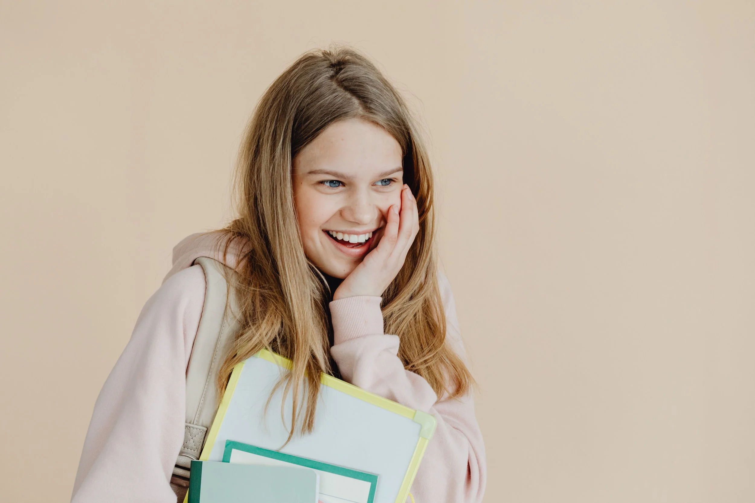 Smiling teen feeling confident and supported while managing back-to-school anxiety.