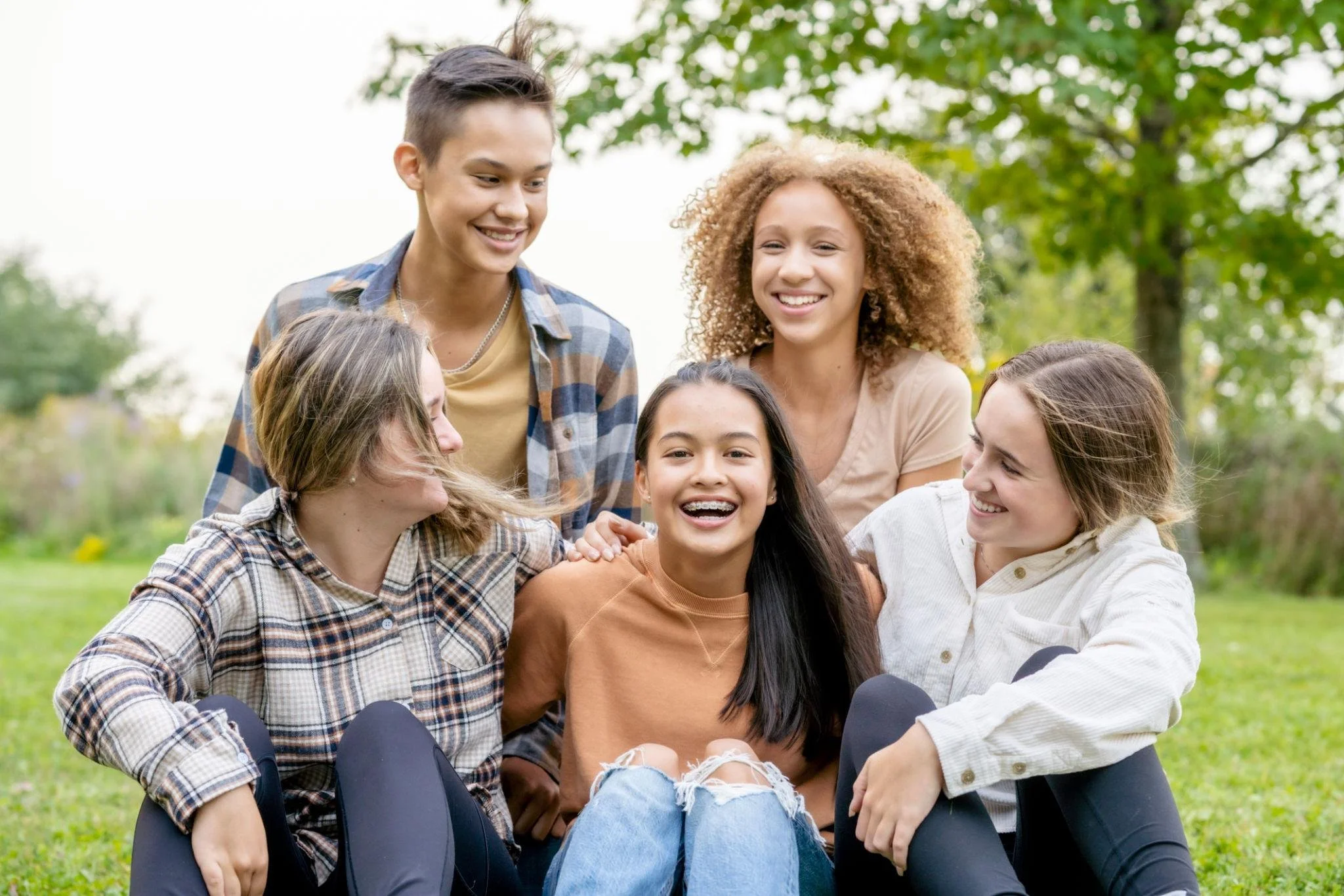 Teenagers building healthy friendships and communication skills that support positive mental health wellness.