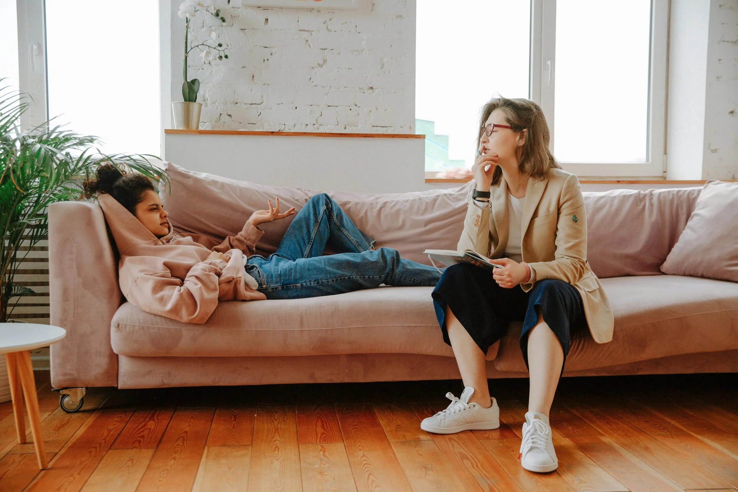 Teen showing emotion during a therapy session, expressing feelings in a safe and supportive counseling environment