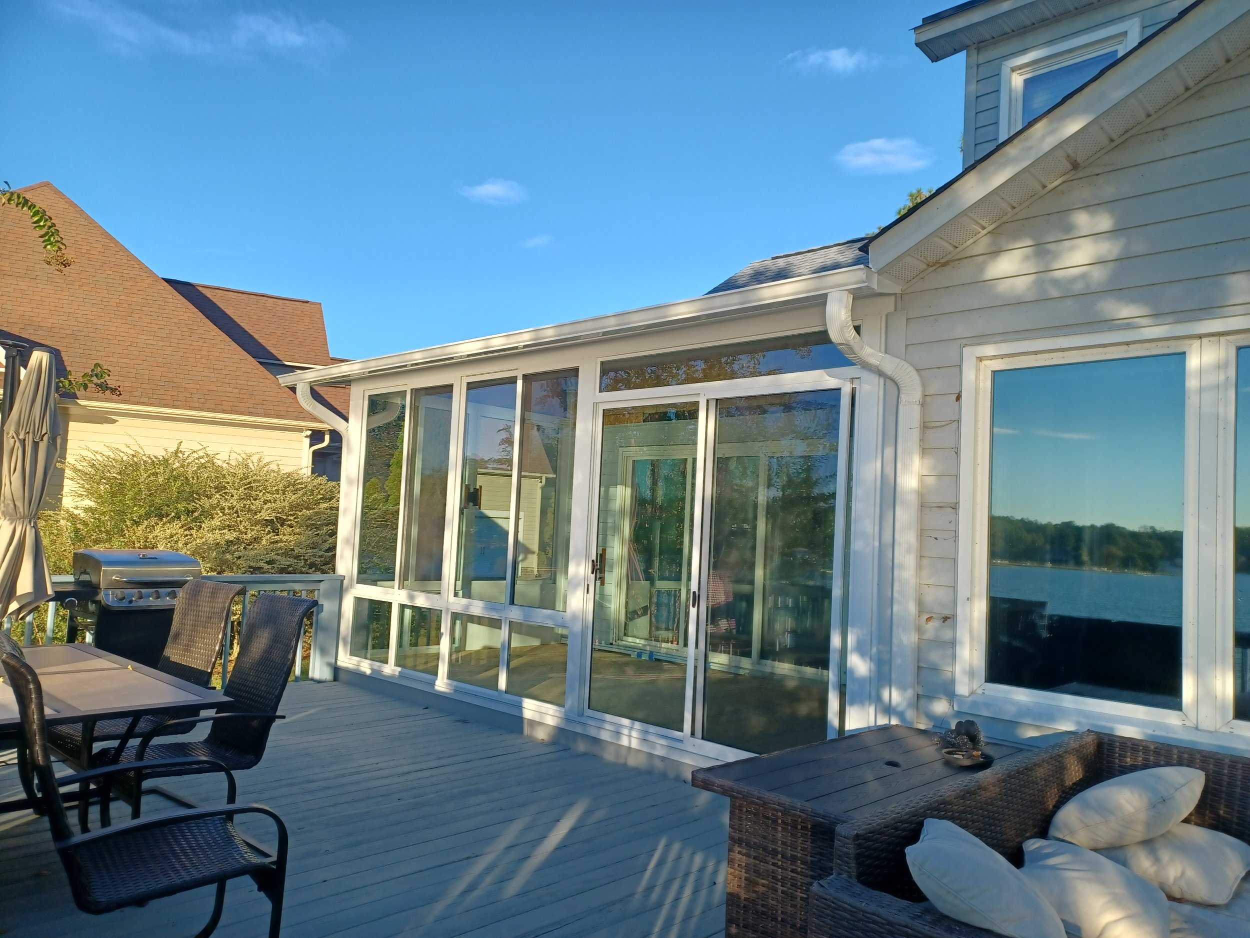 Installed Patio Enclosures custom frame aluminum sunroom under existing roof