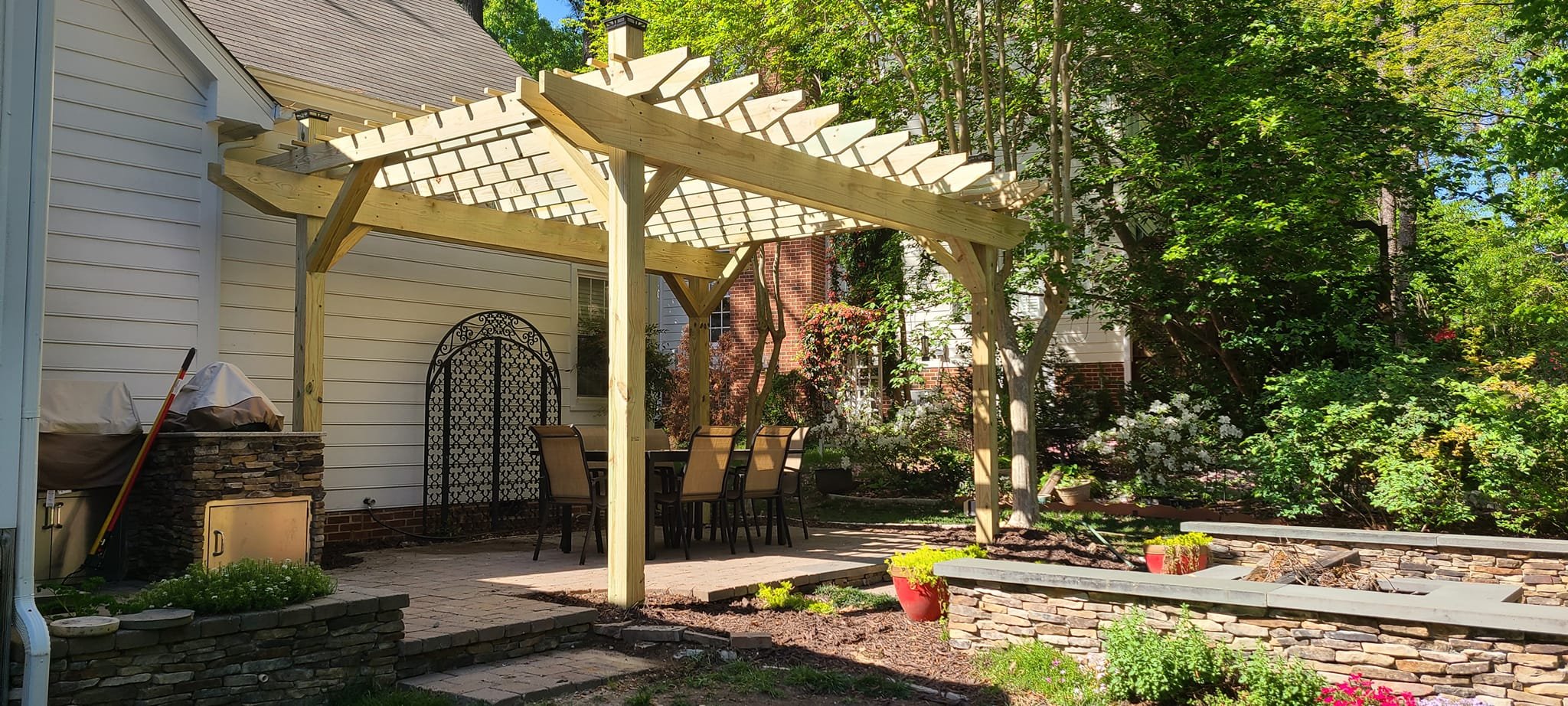 Free standing pergola over paver patio