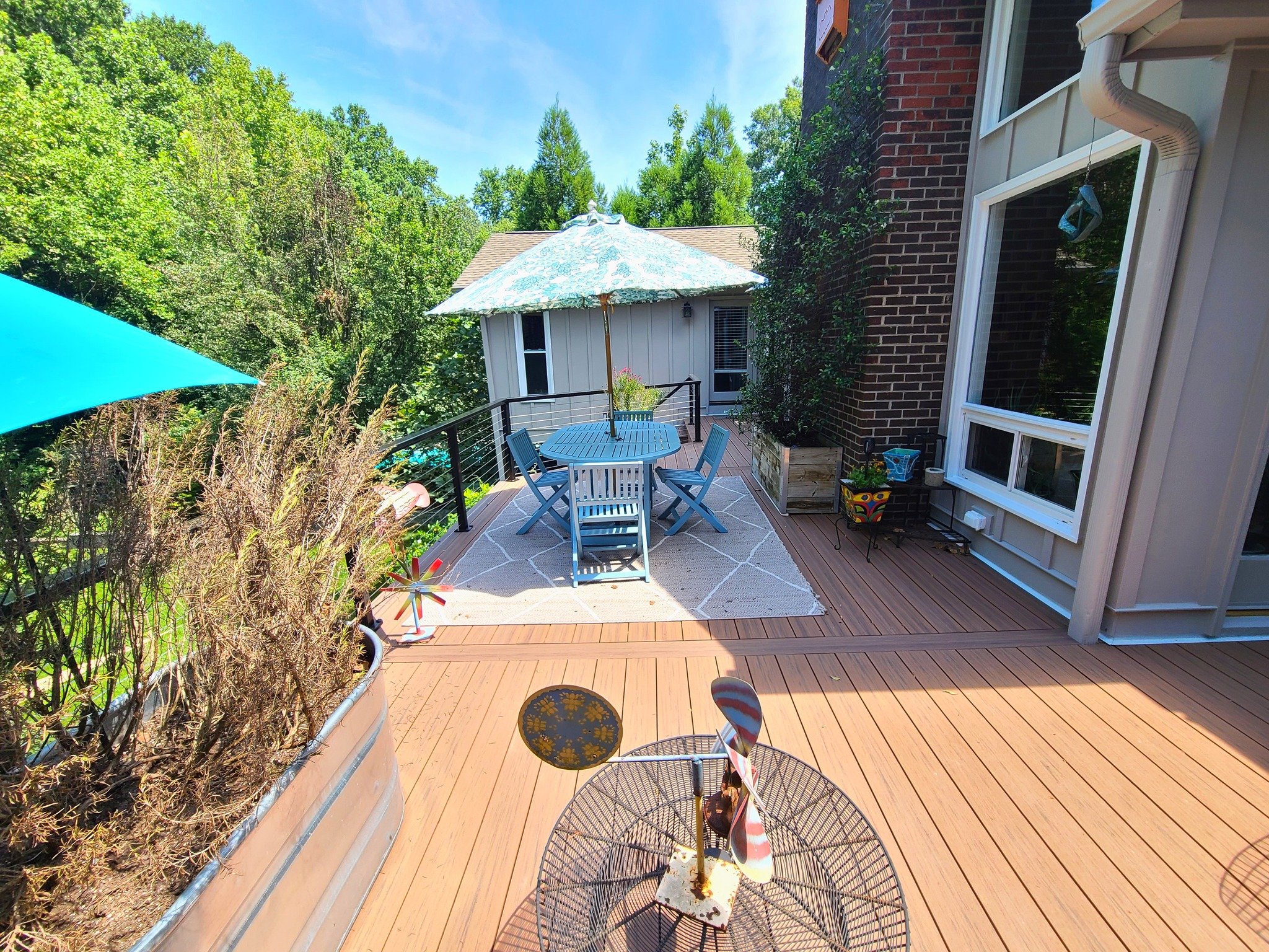 Raleigh, NC Resurfaced deck and rebuilt steps Decking: Deckorators Voyage Costa Railing: RailFX cable with continuous top rail