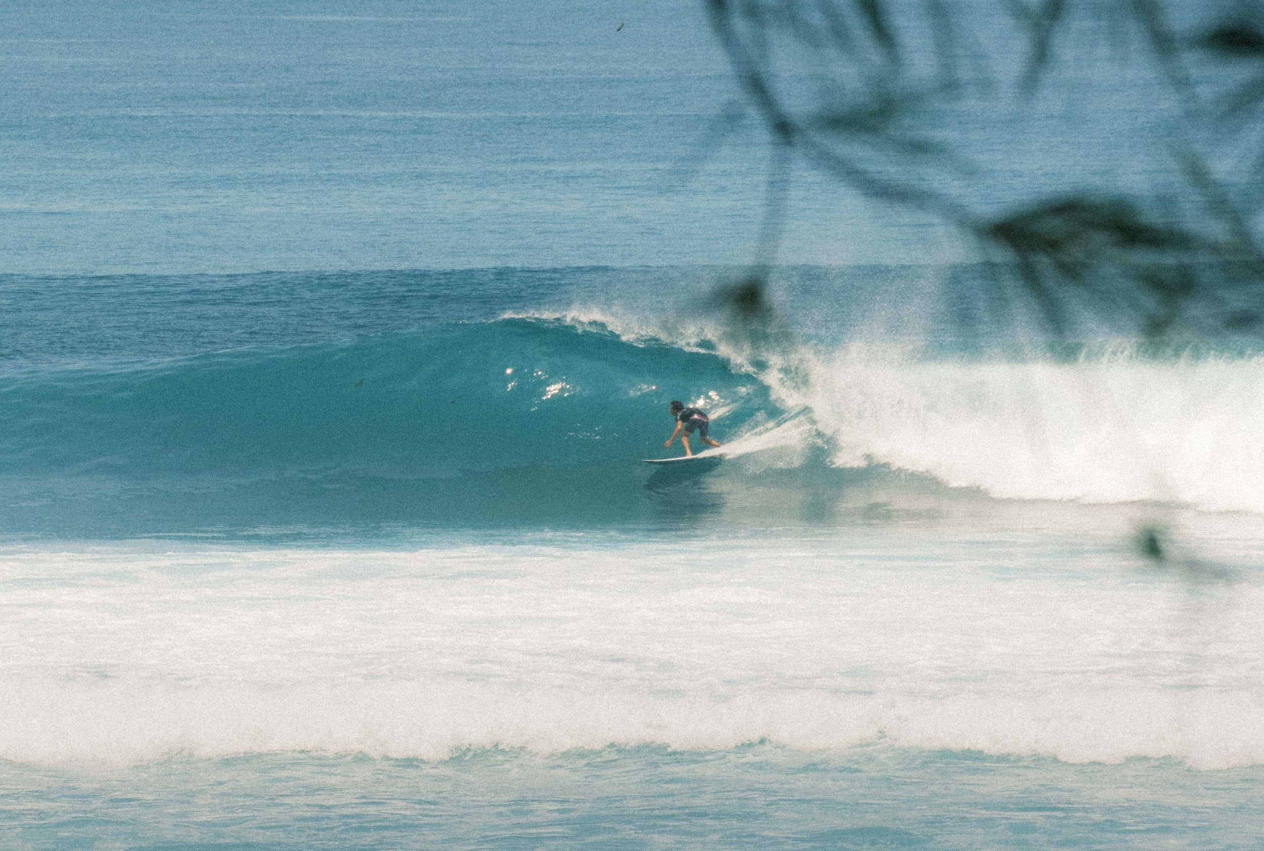 Print artwork of someone surfing near Nyang Nyang Beach, Uluwatu, Bali. Available framed or unframed in 50x70cm and 70x100cm, supporting 1% for the Planet