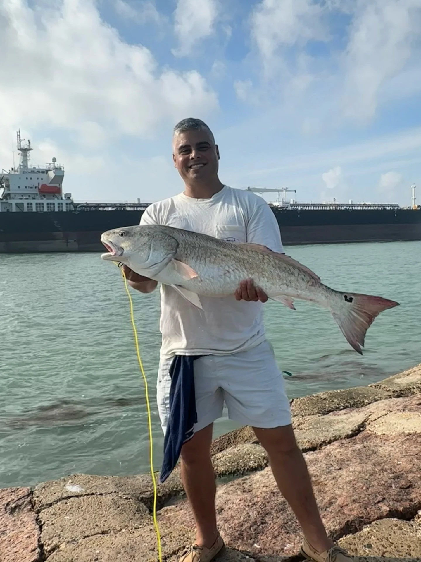 Personal best 34&rdquo; Bull Red off of the @visitspi Jetties at the secret spot last week. Ship for size comparison. The boys still got a little bit of learning to do, and I am having cooler problems. God is good. #kunkleforcongress #tx34 #spi #bull
