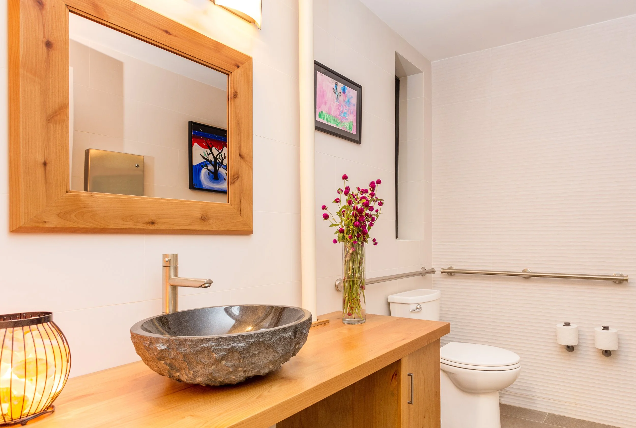 Bathroom interior incorporating sustainable wood materials for the vanity and mirror