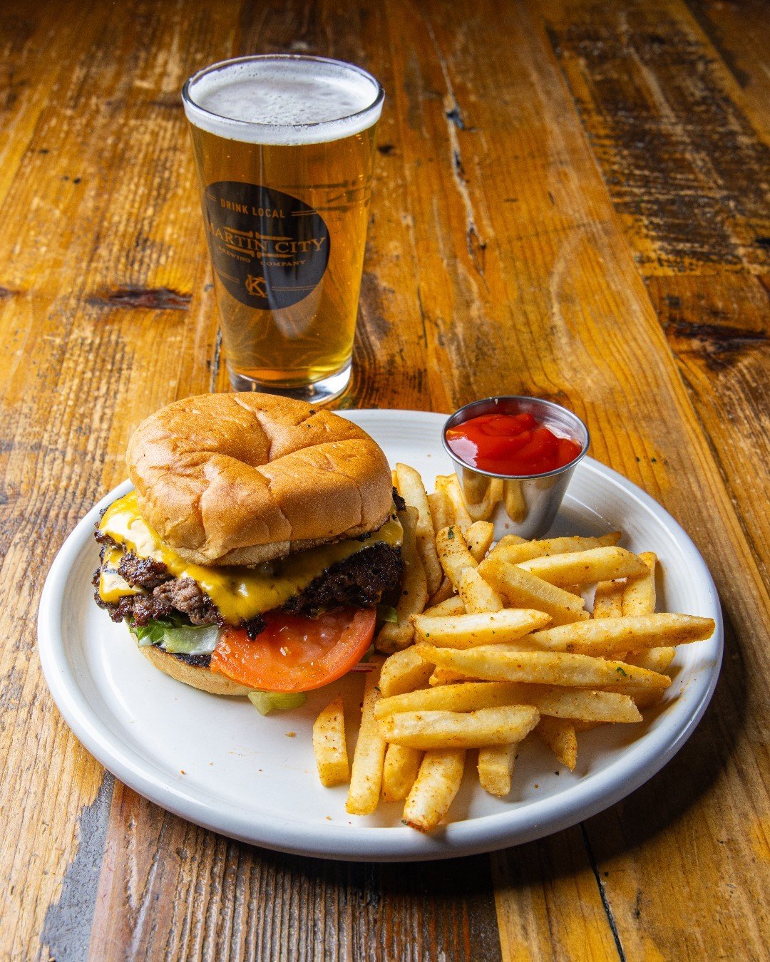 There&rsquo;s nothing 🙅 basic about a big, beautiful burger 🍔 and a bed of hot fries 🍟  with an ice-cold @martincitybrewery beer &ndash; FOR LUNCH‼

👉 Reserve a table: https://bit.ly/3Souk7z
👉 Order Carryout: https://bit.ly/3ISncMF