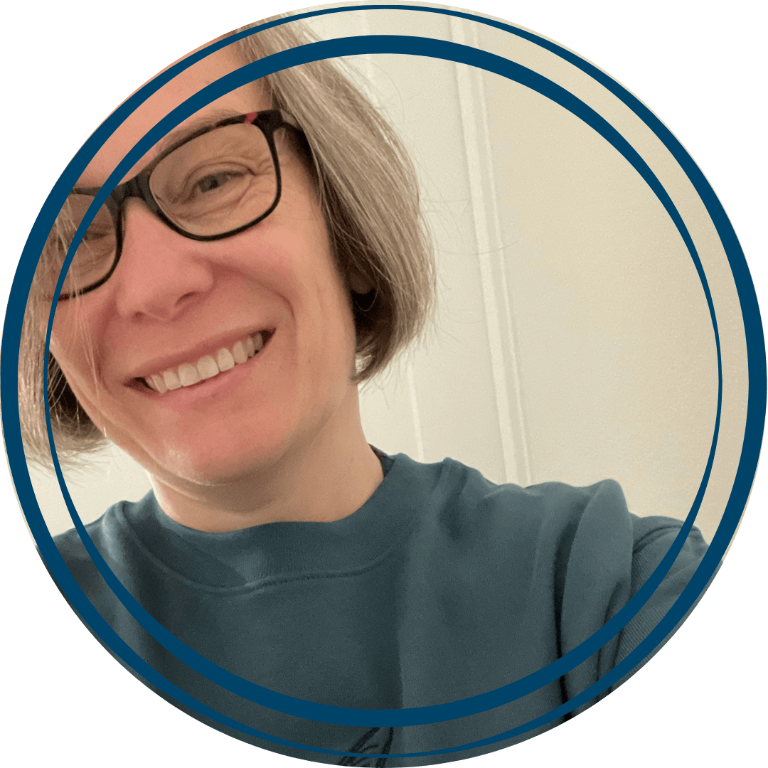 Close upof lady with glasses smiling at camera