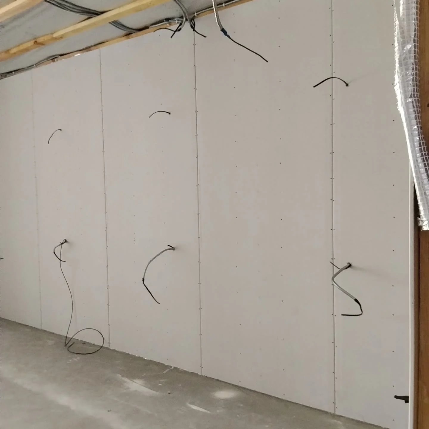 Drywall is nearly finished at Blossom Cottage. Notice the wiring for the craft/classroom stations, the metal framing to facilitate plumbing in the bathrooms, the spackling going on the sheetrock, and the staff cottage is ready for walls soon. #Blosso