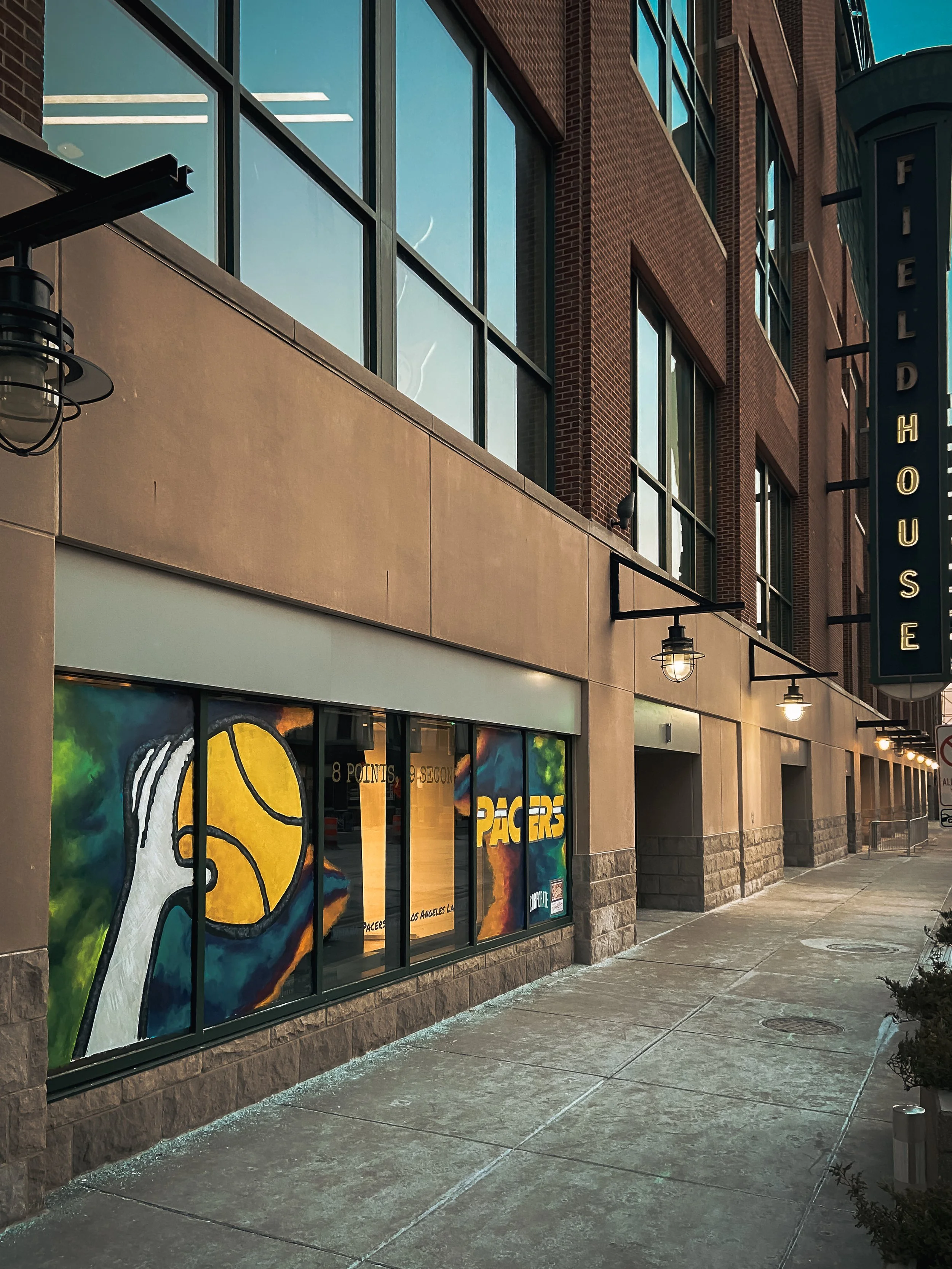 Indiana Pacers basketball mural painted across storefront windows near Gainbridge Fieldhouse in downtown Indianapolis