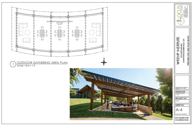 Outdoor gathering pavilion with solar panels on the roof, wooden support beams, and seating area, surrounded by greenery.