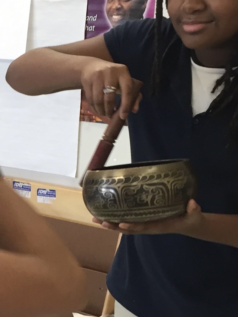 Girl playing with a hula hoop outdoors, smilin