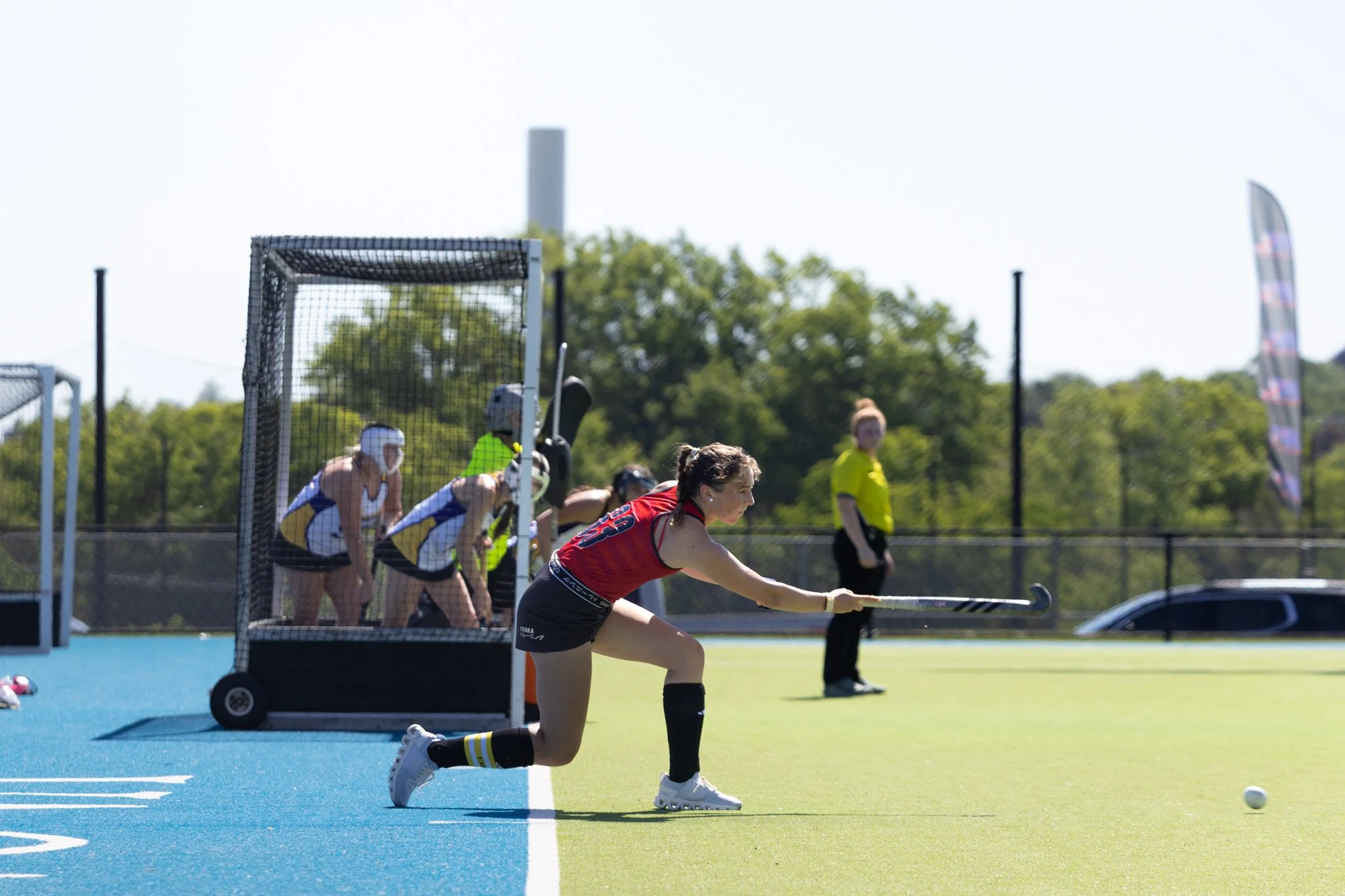 Field hockey player inserting the ball during a corner at The Proving Grounds