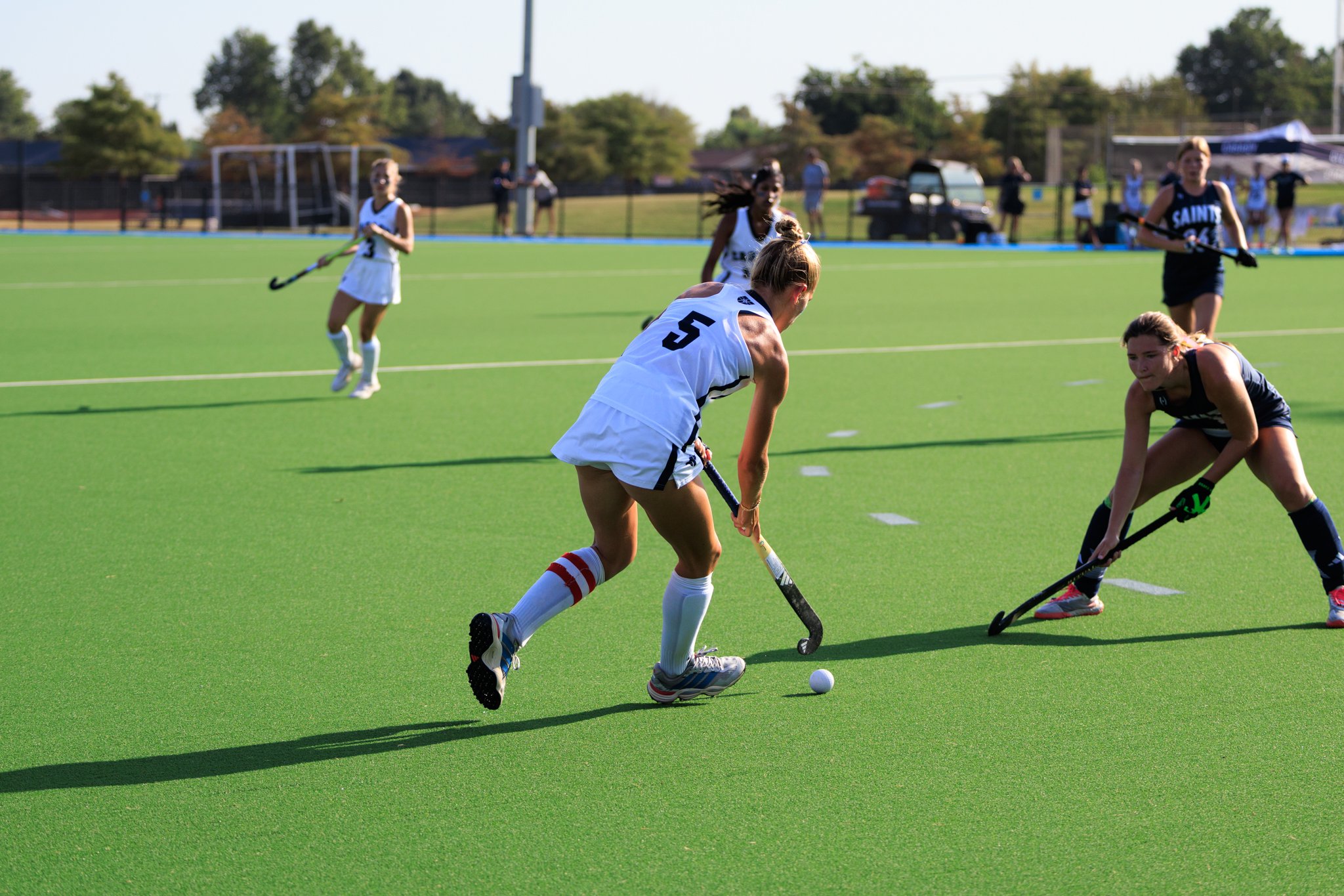 Player pulling the ball right in a field hockey game
