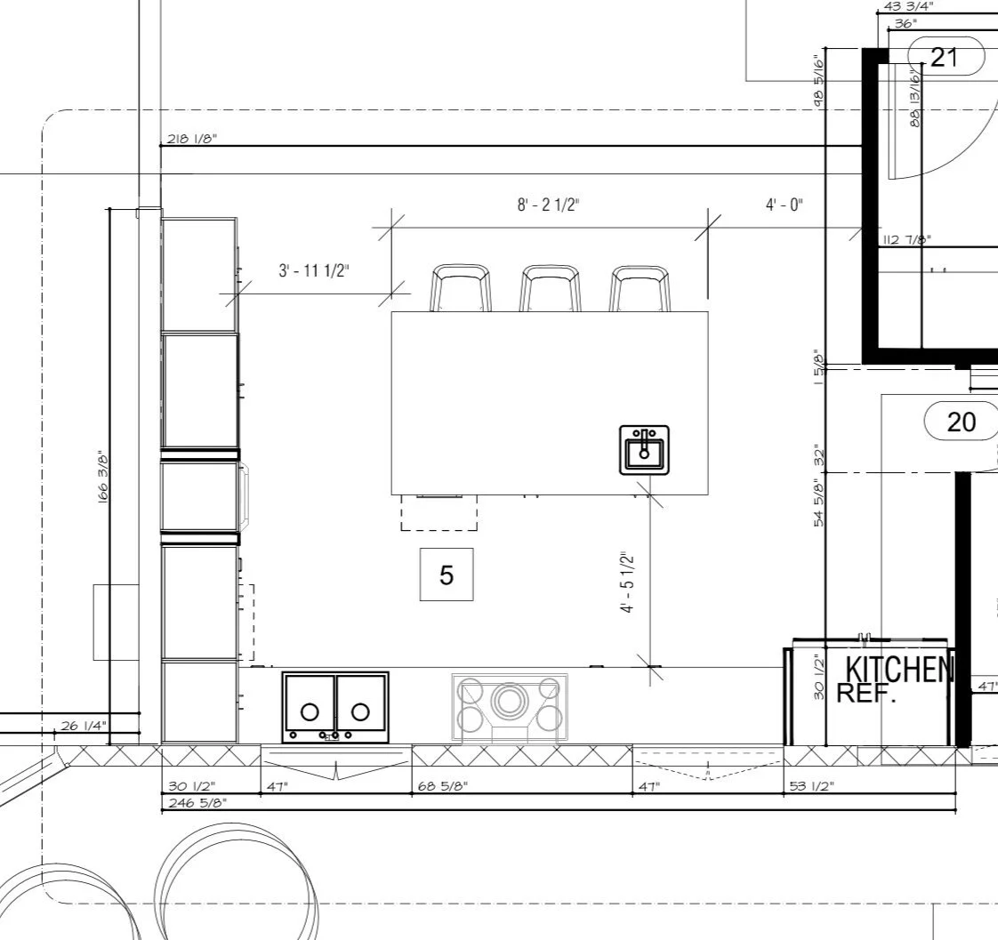 Architectural floor plan of a kitchen with measurements, featuring a kitchen island with three stools, a sink, a stove, and labeled sections including a kitchen reference area.