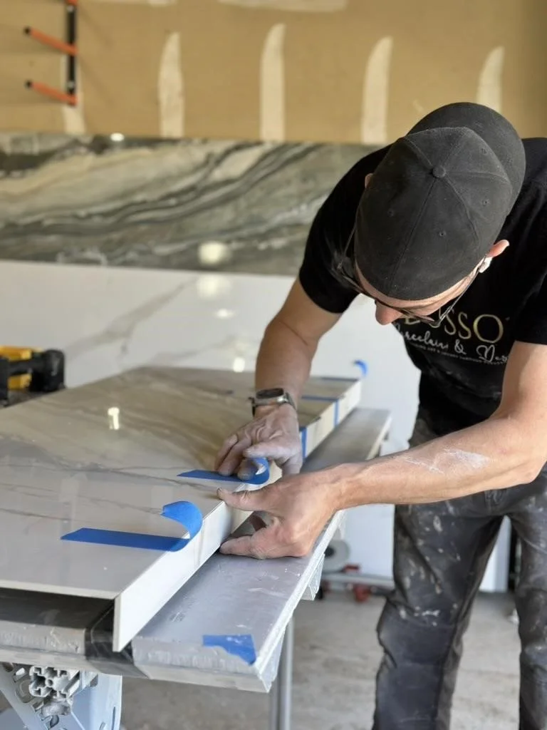 Adam tapes together two edges with 45o miter edges to make a 90o angle