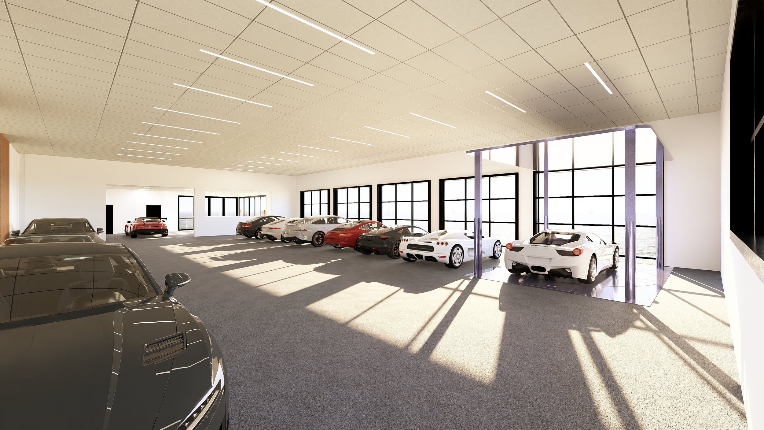 An indoor luxury car garage with multiple high-end sports cars parked, large windows allowing natural light, modern ceiling lighting, and a view of water outside.