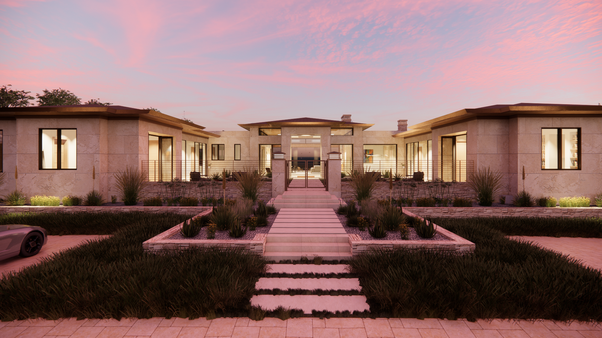 Modern residential building with large windows and a central entrance under a pink sunset sky, surrounded by landscaped garden with plants and paving stones.