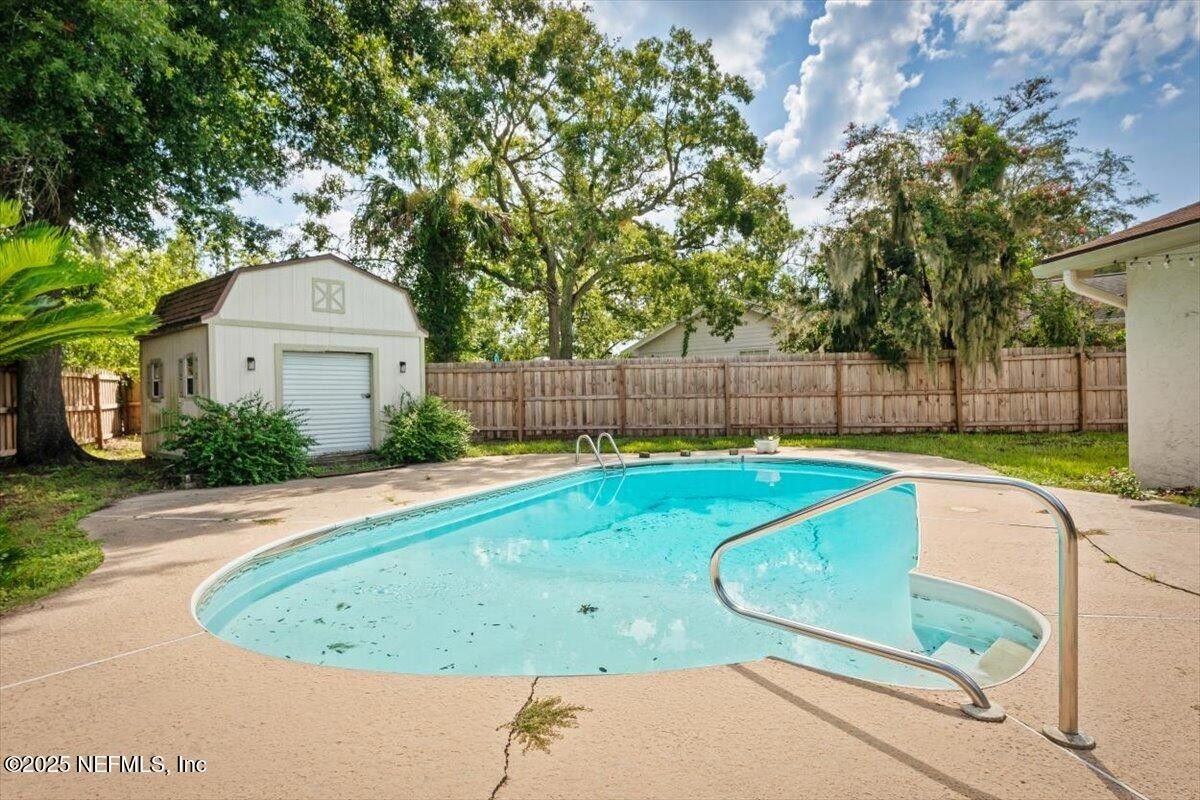 Poolside Potential in Monument Oaks: 11035 Oak Ridge Drive N