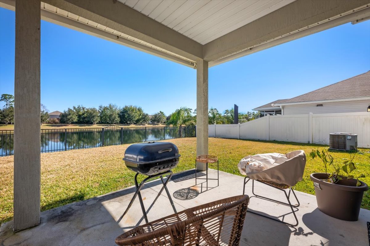 16019 Hutton Ln with pond view and covered back patio.jpg