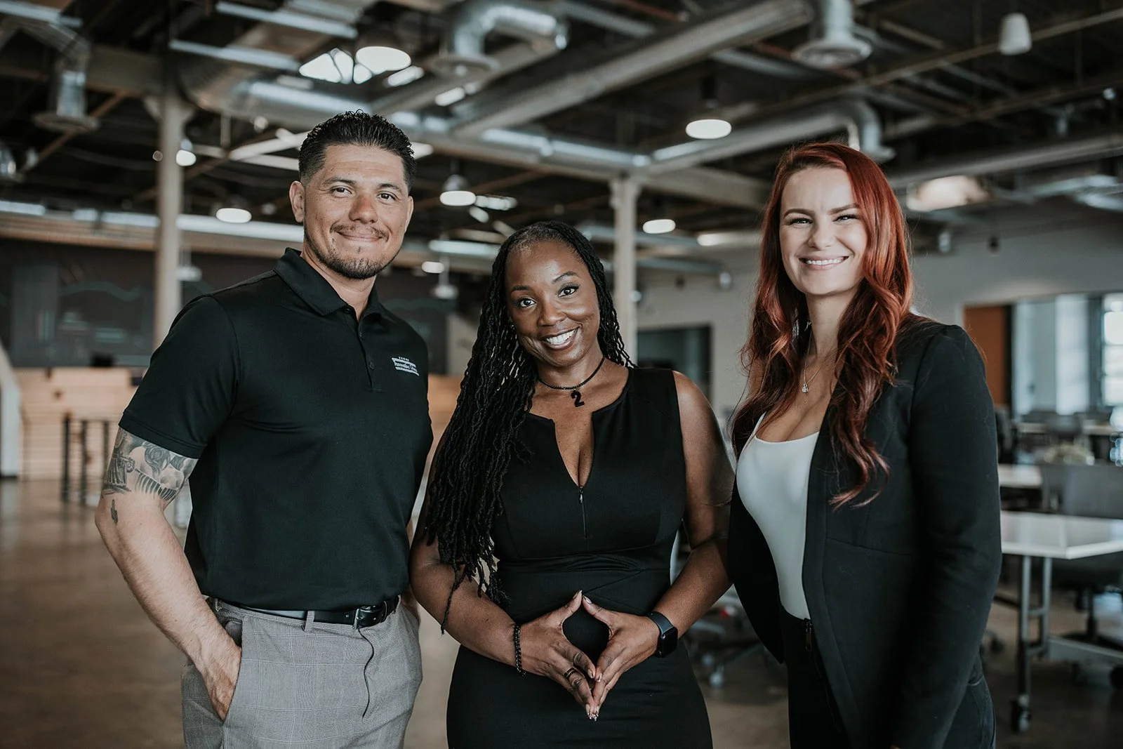 CEO with professionals in a collaborative workspace representing leadership, inclusion, and workforce development through the