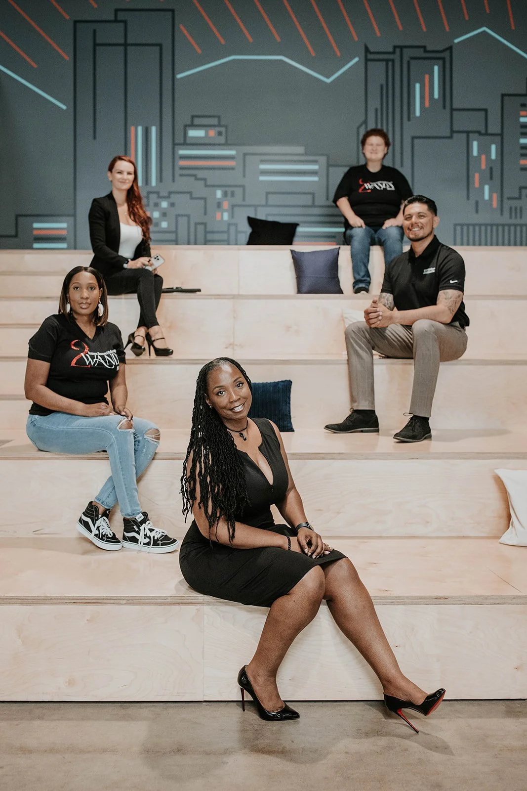 Towanda Carrigan with team members representing connection, collaboration, and community support through the 2Wanda Community Foundation